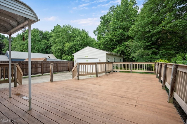3016 Clague Rd, North Olmsted, OH 44070 - wooden terrace with an outdoor structure and a detached garage