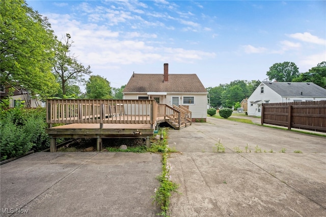 3016 Clague Rd, North Olmsted, OH 44070 - rear view of property featuring a chimney and a deck