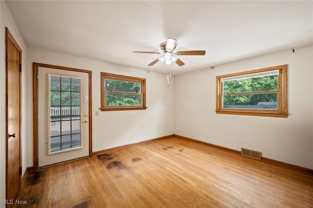 3016 Clague Rd, North Olmsted, OH 44070 - empty room with plenty of natural light, light wood finished floors, and ceiling fan