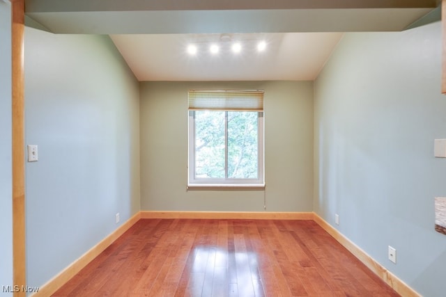 1012 Bunker Dr Unit 307, Akron, OH 44333 - unfurnished room featuring hardwood / wood-style flooring and rail lighting