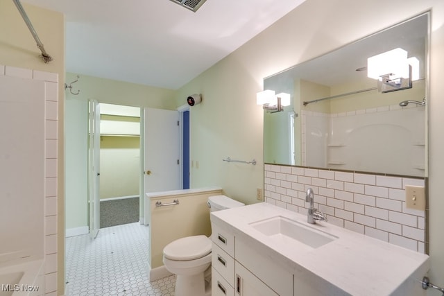 1012 Bunker Dr Unit 307, Akron, OH 44333 - bathroom featuring backsplash, vanity, and shower / bath combination