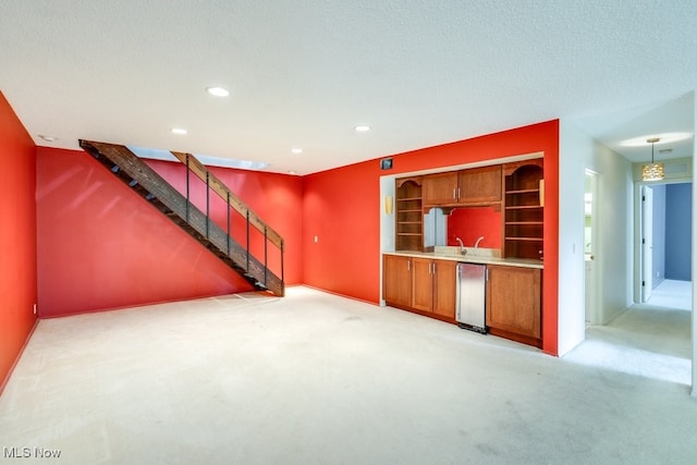 1012 Bunker Dr Unit 307, Akron, OH 44333 - unfurnished living room with light carpet, recessed lighting, and stairs