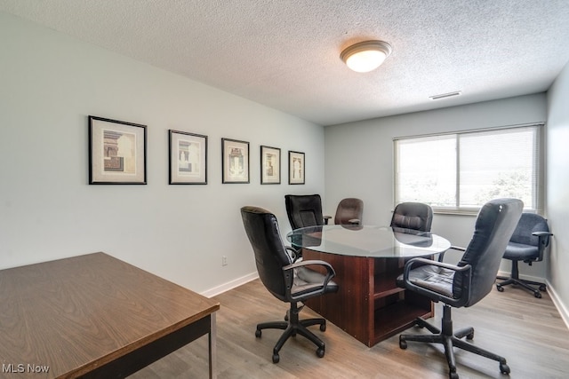 1012 Bunker Dr Unit 307, Akron, OH 44333 - office area featuring light wood finished floors and a textured ceiling