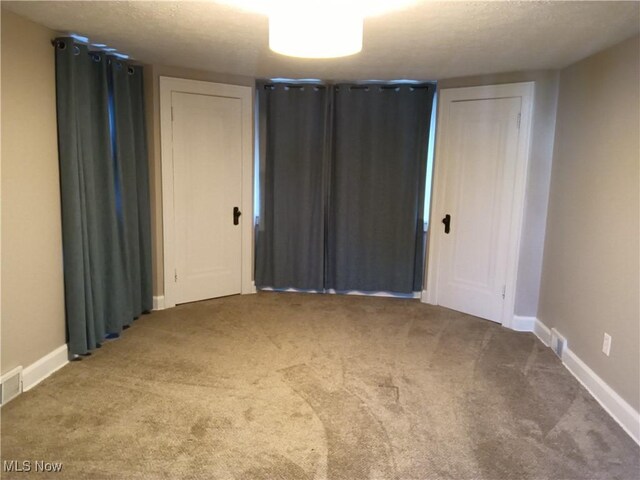 343 Genesee Ave NE, Warren, OH 44483 - unfurnished bedroom with carpet floors and a textured ceiling