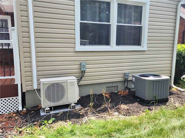 343 Genesee Ave NE, Warren, OH 44483 - exterior view of a central AC unit and crawl space