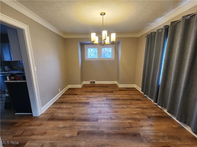 343 Genesee Ave NE, Warren, OH 44483 - unfurnished dining area featuring dark wood-style flooring, a chandelier, a textured ceiling, and crown molding