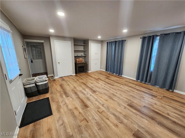 343 Genesee Ave NE, Warren, OH 44483 - unfurnished living room with recessed lighting and light wood-style flooring