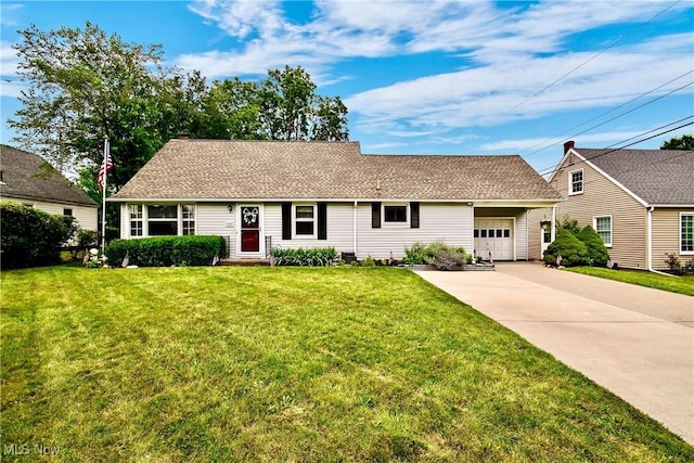 4219 3rd St NW, Canton, OH 44708 - view of front of property featuring an attached garage, concrete driveway, and a front lawn