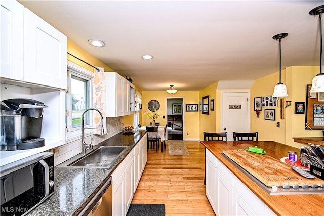 4219 3rd St NW, Canton, OH 44708 - kitchen featuring light wood-style flooring, white cabinets, dishwasher, and recessed lighting