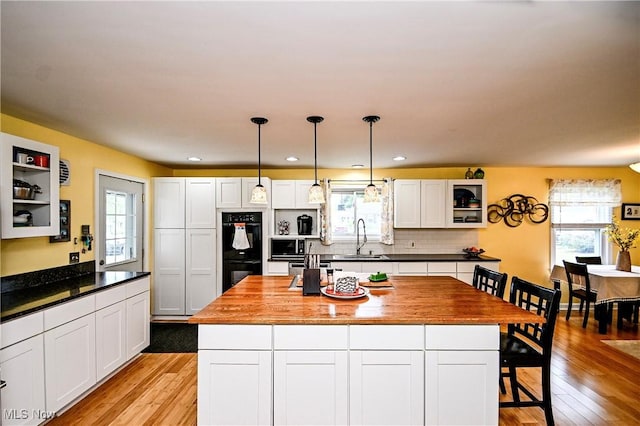 4219 3rd St NW, Canton, OH 44708 - kitchen featuring open shelves, healthy amount of natural light, white cabinets, and recessed lighting