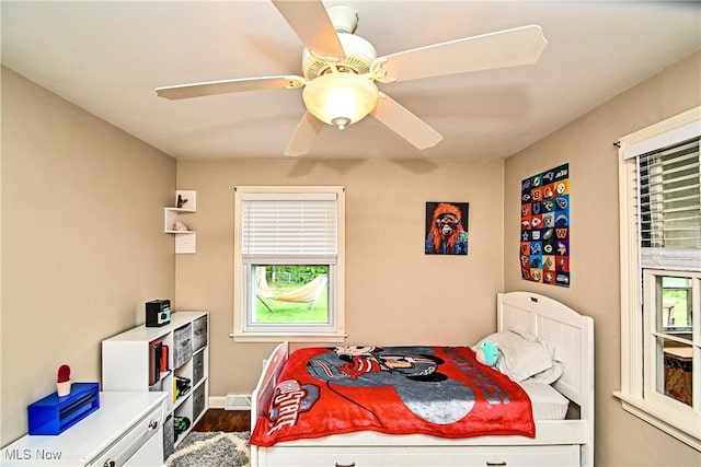 4219 3rd St NW, Canton, OH 44708 - bedroom with dark wood finished floors and a ceiling fan
