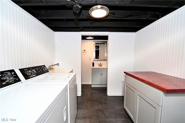 4219 3rd St NW, Canton, OH 44708 - washroom featuring a sink and separate washer and dryer