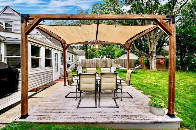 4219 3rd St NW, Canton, OH 44708 - fenced backyard with a deck, outdoor dining area, and a grill