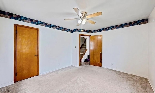4611 W 158th St, Cleveland, OH 44135 - unfurnished room with a ceiling fan, carpet, and stairway