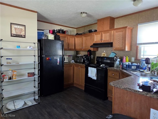 10039 State Route 700, Mantua, OH 44255 - kitchen featuring black appliances, under cabinet range hood, dark wood-style flooring, crown molding, and brown cabinetry