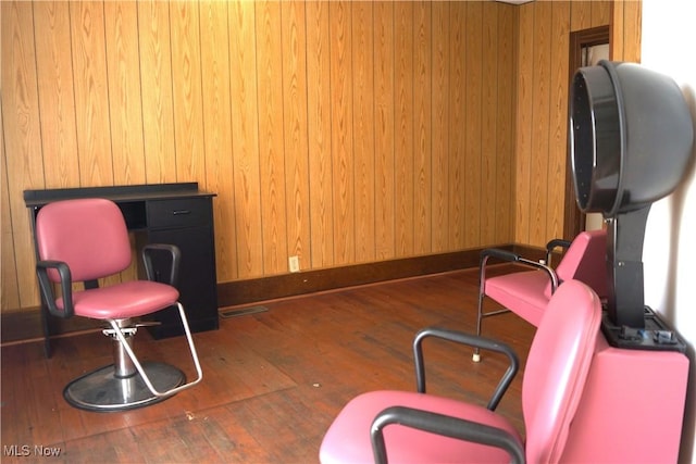 208 2nd St SW, Carrollton, OH 44615 - living area with hardwood / wood-style floors and wooden walls
