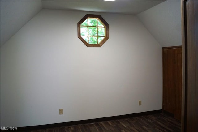 208 2nd St SW, Carrollton, OH 44615 - additional living space featuring dark wood-type flooring and vaulted ceiling