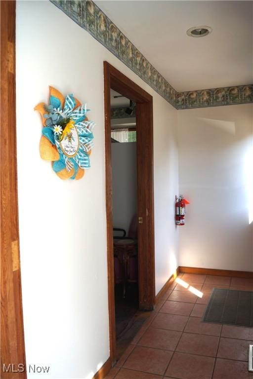 208 2nd St SW, Carrollton, OH 44615 - hall with tile patterned floors and baseboards