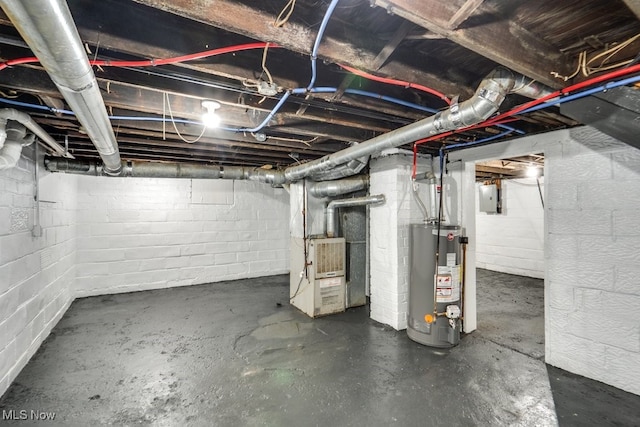 2819 4th St NW, Canton, OH 44708 - unfinished below grade area featuring gas water heater, heating unit, and concrete block wall