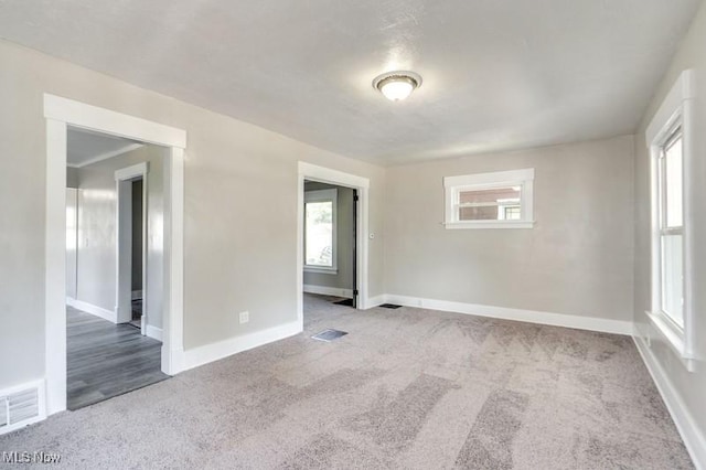 2819 4th St NW, Canton, OH 44708 - empty room featuring carpet and healthy amount of natural light