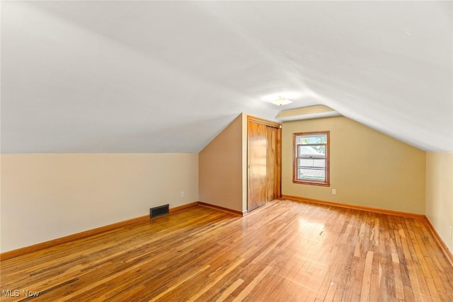 2330 Parkway Blvd, Alliance, OH 44601 - additional living space with light wood-style flooring and lofted ceiling