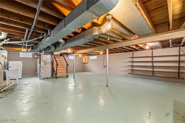 2330 Parkway Blvd, Alliance, OH 44601 - basement with stairway, heating unit, and electric panel