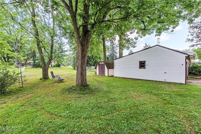 2330 Parkway Blvd, Alliance, OH 44601 - view of grassy yard with a shed