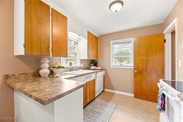 2330 Parkway Blvd, Alliance, OH 44601 - kitchen featuring white appliances, brown cabinets, and light countertops