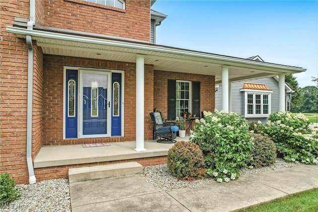 6388 Brianna Way NW, Warren, OH 44481 - view of exterior entry with covered porch and brick siding