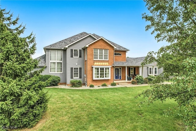 6388 Brianna Way NW, Warren, OH 44481 - traditional home with a front yard and brick siding