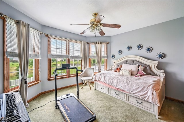 6388 Brianna Way NW, Warren, OH 44481 - carpeted bedroom with baseboards and a ceiling fan