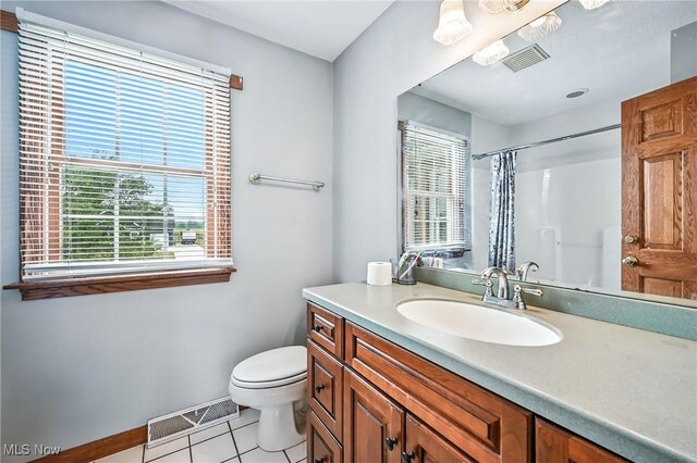 6388 Brianna Way NW, Warren, OH 44481 - bathroom featuring tile patterned flooring, plenty of natural light, vanity, and a shower with shower curtain