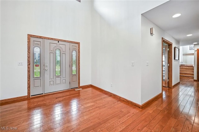 6388 Brianna Way NW, Warren, OH 44481 - entrance foyer featuring wood-type flooring, stairway, and a high ceiling