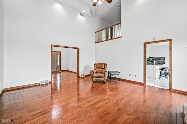 6388 Brianna Way NW, Warren, OH 44481 - living area featuring a ceiling fan, hardwood / wood-style flooring, and high vaulted ceiling