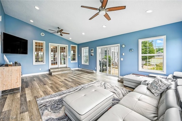 6388 Brianna Way NW, Warren, OH 44481 - living area featuring ceiling fan, wood finished floors, lofted ceiling, recessed lighting, and a baseboard heating unit