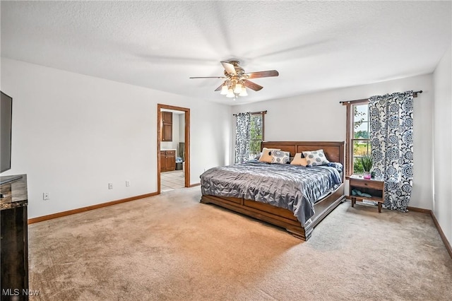 6388 Brianna Way NW, Warren, OH 44481 - bedroom with carpet floors, a textured ceiling, ensuite bathroom, and ceiling fan