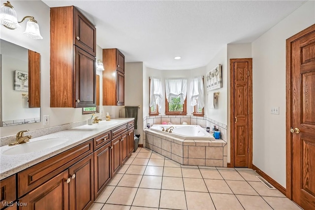 6388 Brianna Way NW, Warren, OH 44481 - full bath with double vanity, a garden tub, and tile patterned floors