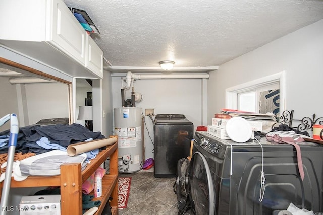 195 S Point Dr, Avon Lake, OH 44012 - laundry area featuring gas water heater, washer and clothes dryer, cabinet space, and a textured ceiling