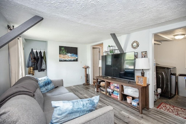 195 S Point Dr, Avon Lake, OH 44012 - living room featuring wood finished floors, separate washer and dryer, and a textured ceiling
