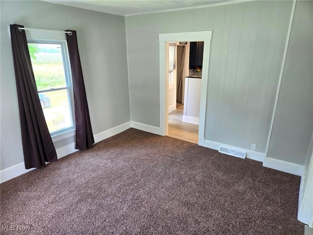 3986 Newton Falls Bailey Rd, Newton Falls, OH 44444 - carpeted empty room with crown molding and wood walls