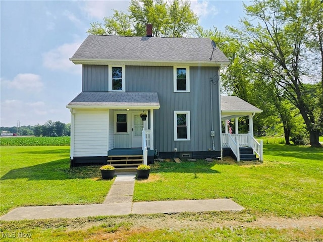 3986 Newton Falls Bailey Rd, Newton Falls, OH 44444 - view of front of house featuring covered porch, a front yard, and a shingled roof