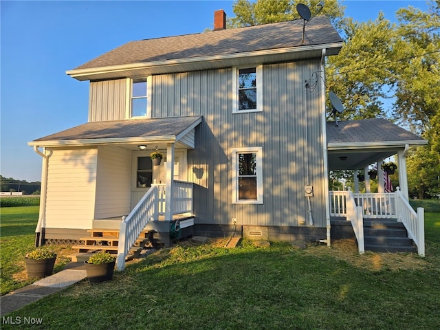 3986 Newton Falls Bailey Rd, Newton Falls, OH 44444 - view of front facade featuring a porch, a chimney, a front yard, and roof with shingles