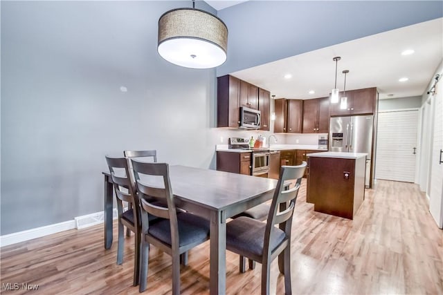 7208 S Galahad Pl, Concord Township, OH 44077 - dining area with light wood-type flooring and recessed lighting