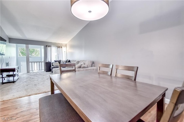7208 S Galahad Pl, Concord Township, OH 44077 - dining area featuring vaulted ceiling and light wood-type flooring