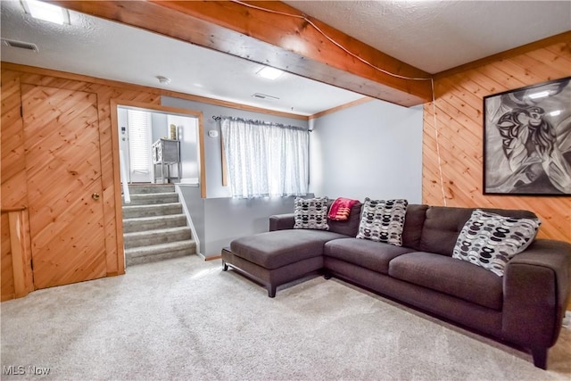 7208 S Galahad Pl, Concord Township, OH 44077 - carpeted living room with wood walls and stairway
