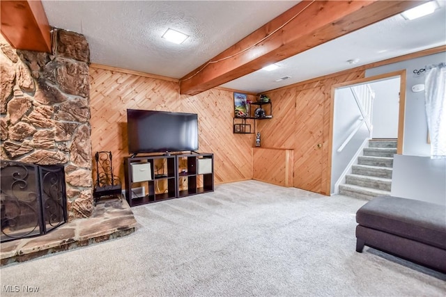 7208 S Galahad Pl, Concord Township, OH 44077 - carpeted living room featuring stairs, wooden walls, a fireplace, and a textured ceiling