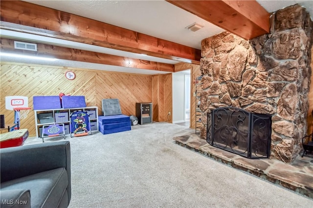 7208 S Galahad Pl, Concord Township, OH 44077 - carpeted living room with wooden walls, a stone fireplace, and beam ceiling