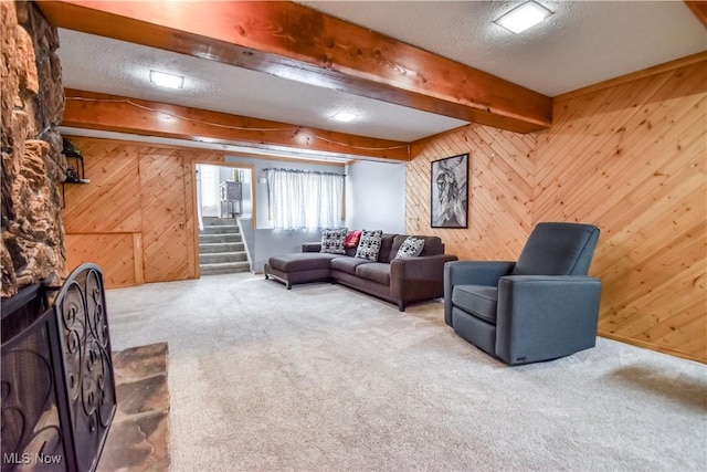7208 S Galahad Pl, Concord Township, OH 44077 - carpeted living area featuring wood walls, stairs, and beam ceiling