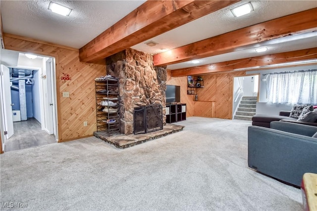 7208 S Galahad Pl, Concord Township, OH 44077 - living room with wooden walls, carpet flooring, stairs, a textured ceiling, and beamed ceiling