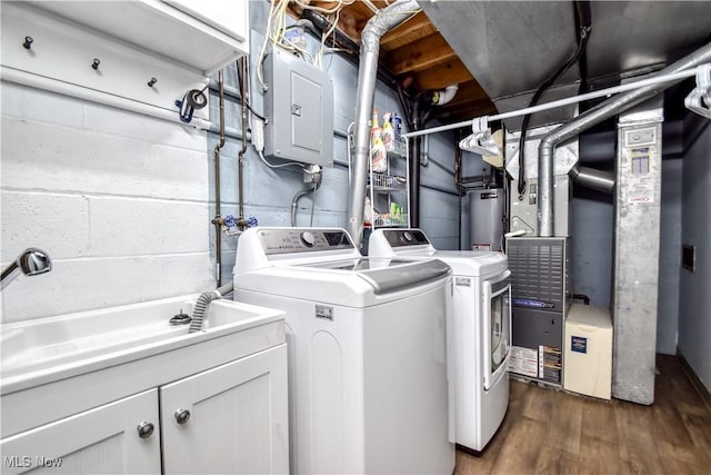 7208 S Galahad Pl, Concord Township, OH 44077 - laundry area featuring washing machine and clothes dryer, cabinet space, wood finished floors, gas water heater, and heating unit